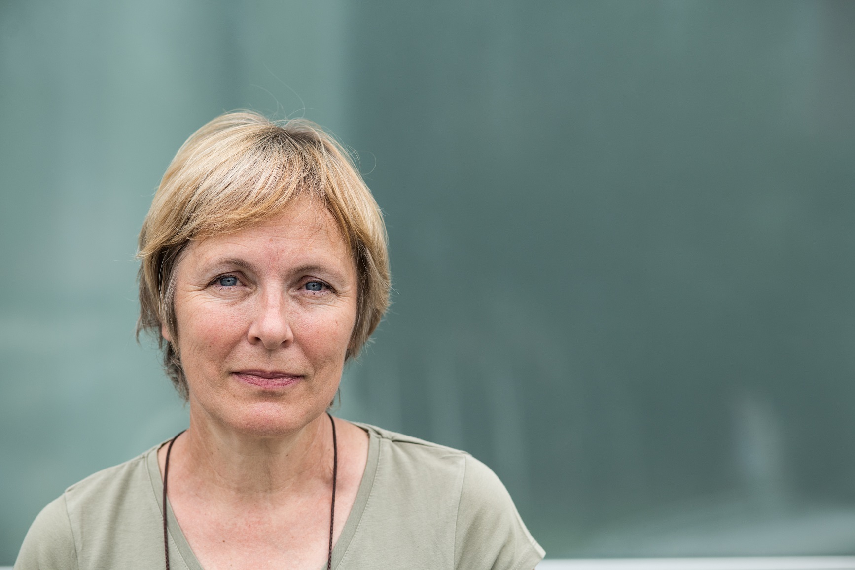 Mature woman in green shirt